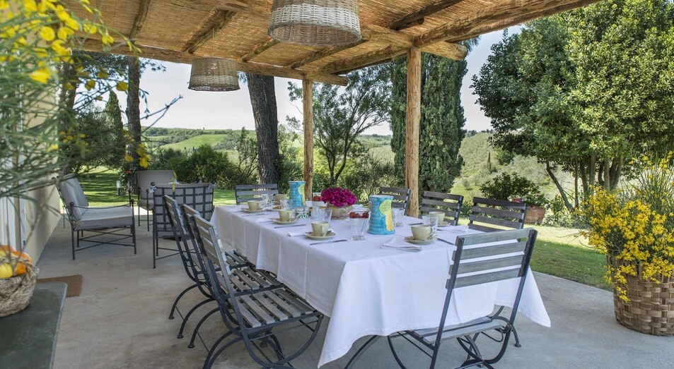 The pergola dining table, set for lunch